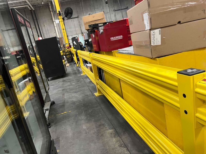 A yellow conveyor belt in an industrial setting.